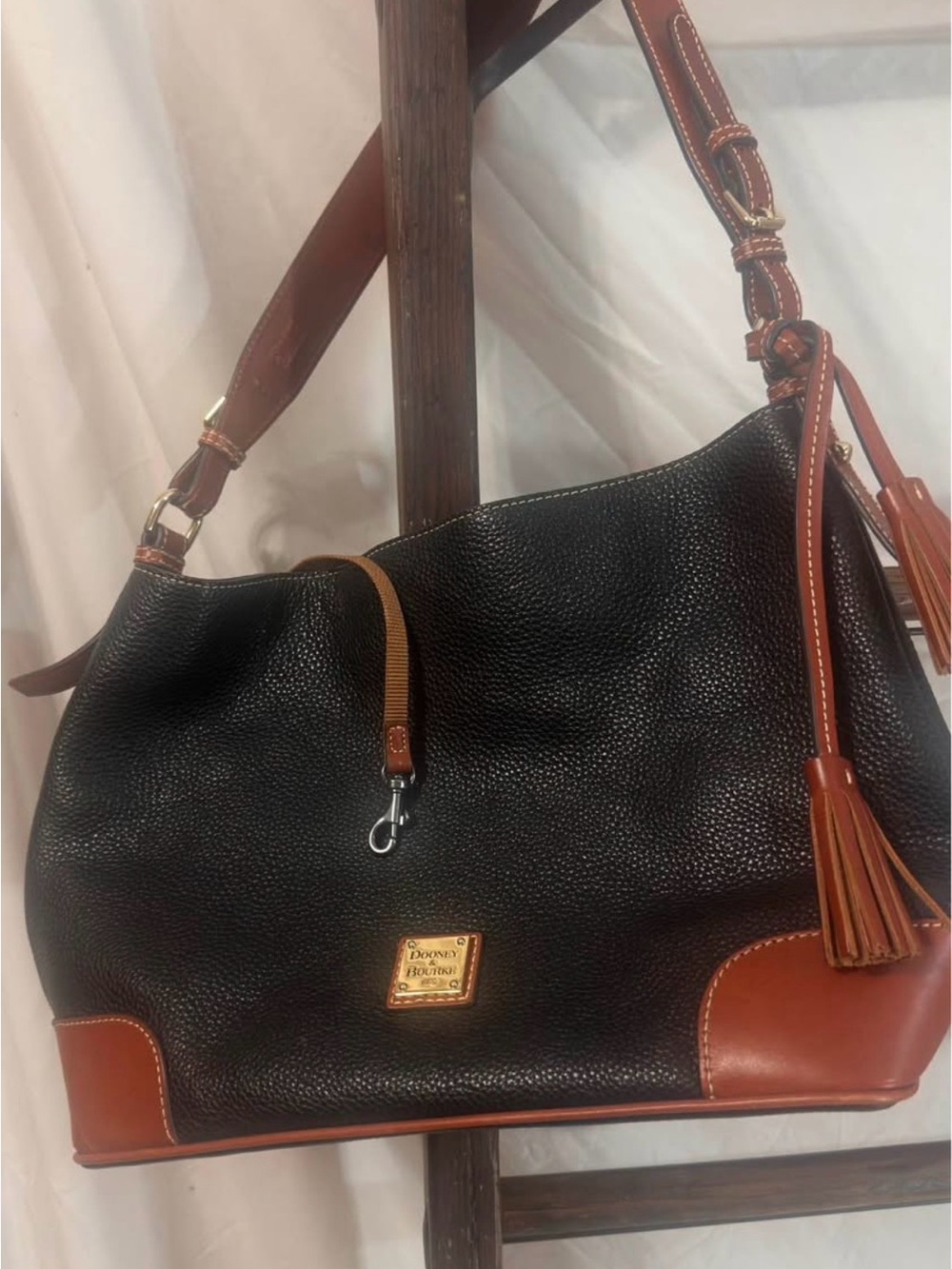 Dooney & Bourke Black Leather Hobo with Brown Trim and Gold Hardware